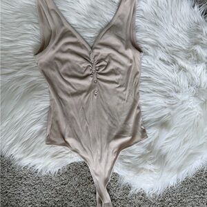 Anthropologie Elodie Nude Beige Sleeveless Snap Front Bodysuit